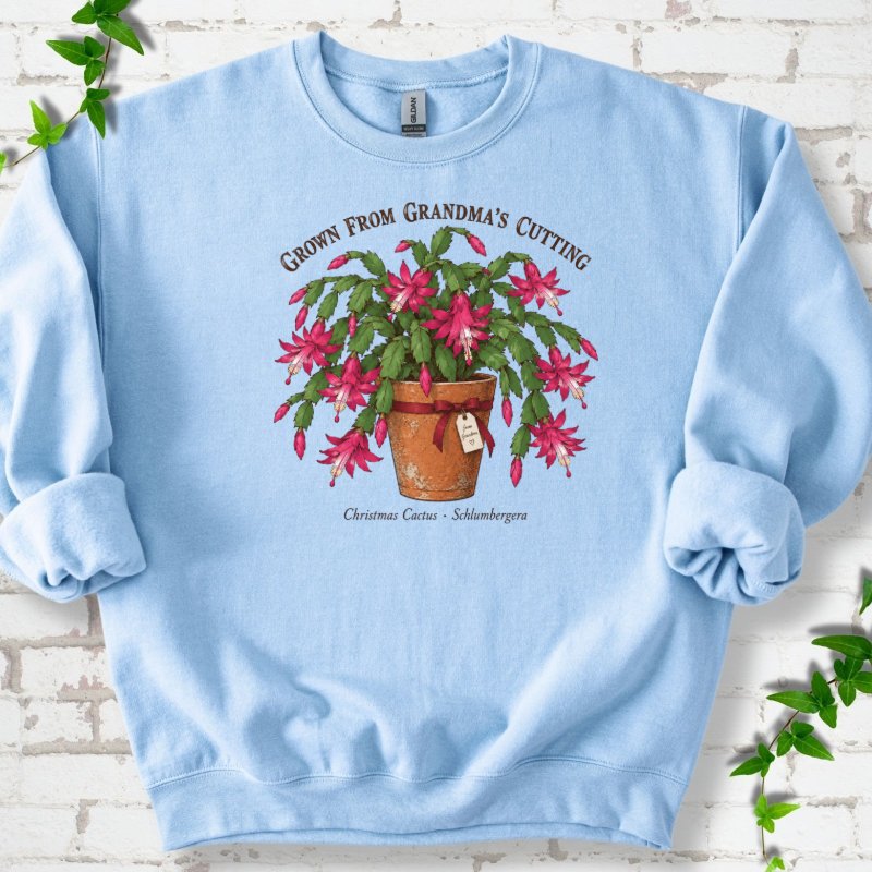 Grandma’s Cutting Christmas Cactus Sweatshirt in Light Blue – PlotlyGarden